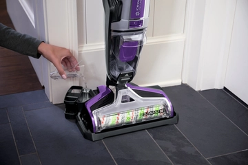 Pouring Self Cleanout formula into storage tray.