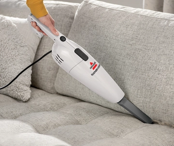 Using FeatherWeight Stick Vac as a Hand Vac with Crevcie Tool to vacuum couch cushion