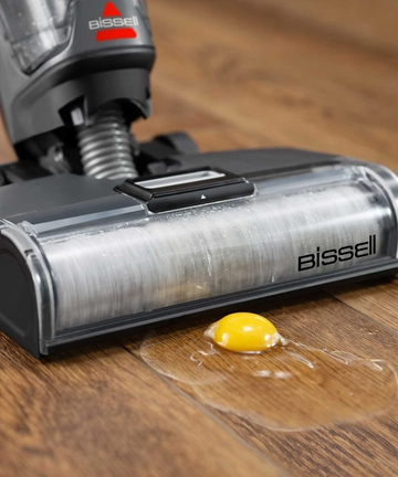 CrossWave OmniForce All-in-One Multi-Surface Cleaner vacuuming egg from hard flooring