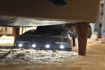 vacuuming under furniture headlight feature