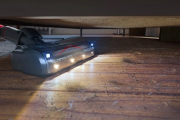 PowerClean FurGuard vacuuming pet hair and dirt from under furniture