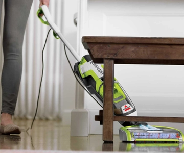 CrossWave Turbo Hard Floor and Area Rug Wet Dry Vac cleaning hard flooring under table.