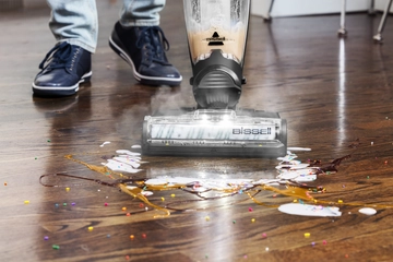 CrossWave HydroSteam Wet Dry Mop Mopping sticky mess from wood flooring.