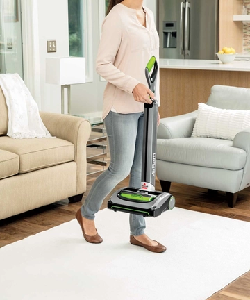 Carrying AirRam Cordless Vacuum to storage