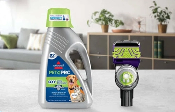 Bottle of PET PRO OXY Urine Eliminator Formula and 2-in-1 Pet Tool.