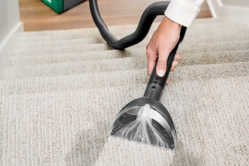 Using 6 inch tool on end of hose to deep clean stairs.