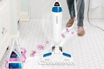 PowerFresh Steam Mop steaming tile flooring in bathroom