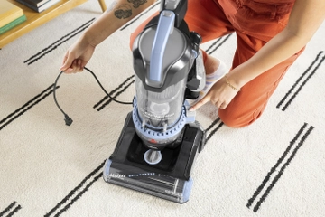 Rewind cord back into vacuum
