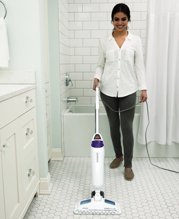 Using PowerFresh Pet Steam Mop to steam bathroom area.